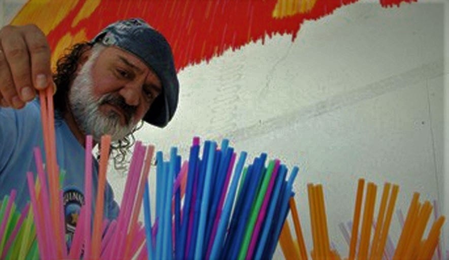Hand placing straws